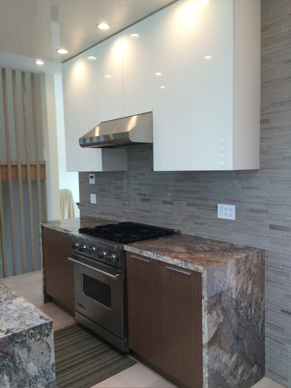 Granite countertop with stacked-stone backsplash