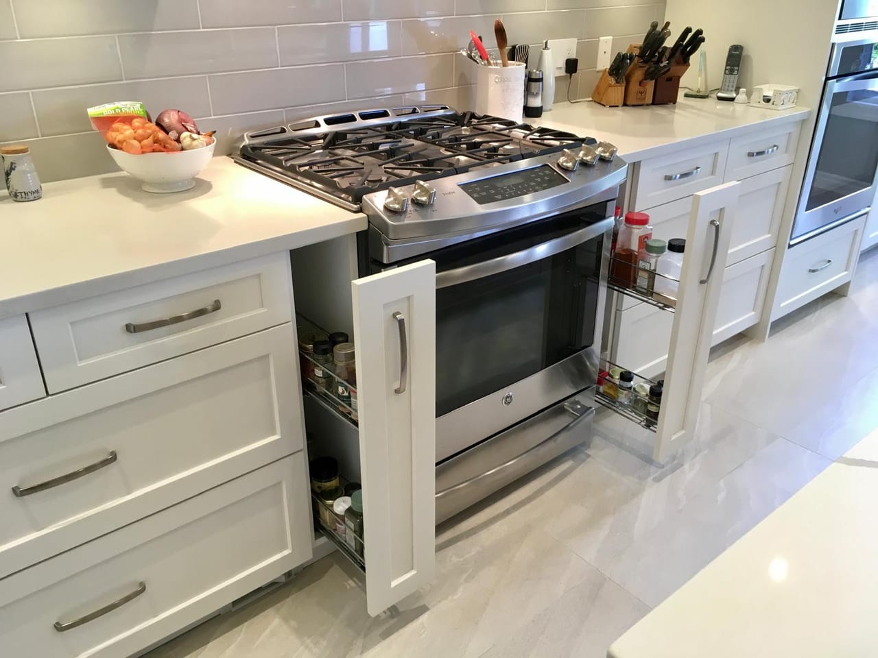White shaker kitchen with pull-out spice racks
